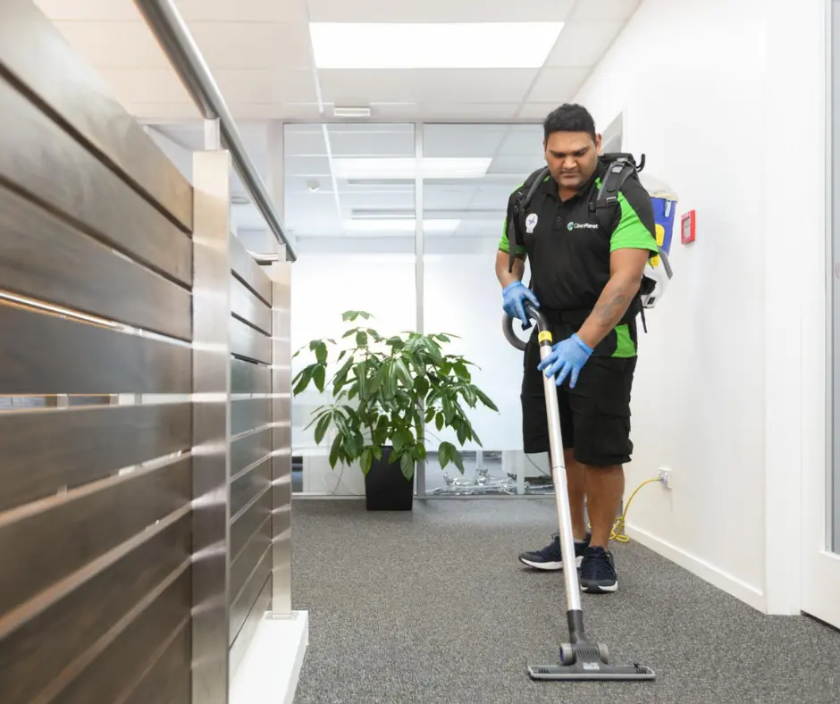 Clean Planet team cleaning a vinyl floor in Auckland